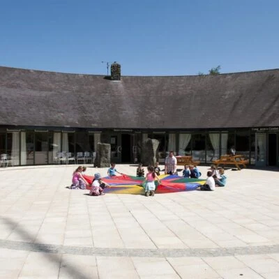 An Creagán (2 bedroom) – Tornoge - kids playing with a parashot